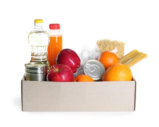 Photo of Humanitarian aid. Different food products for donation in box isolated on white