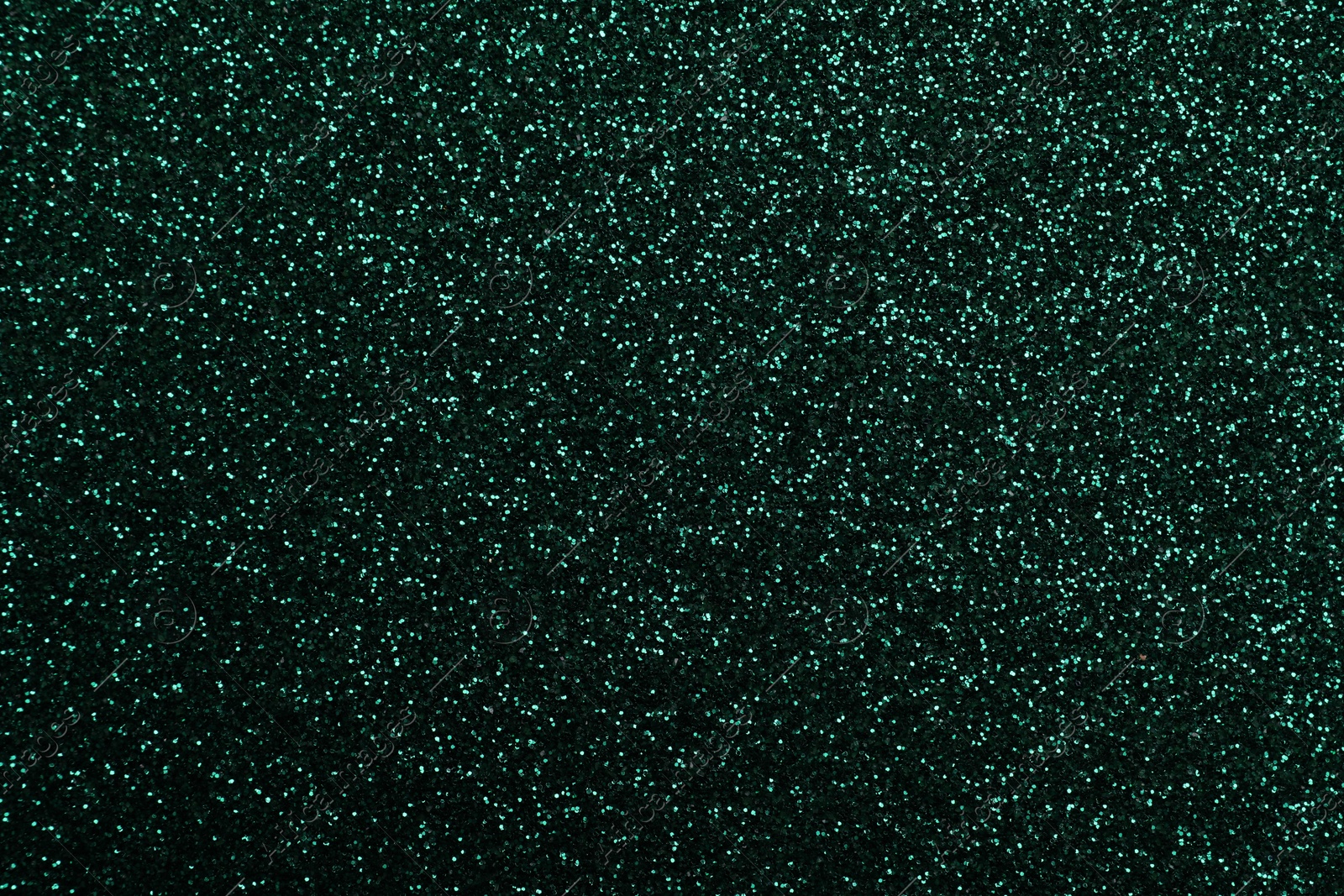 Photo of Shiny dark green glitter as background, closeup