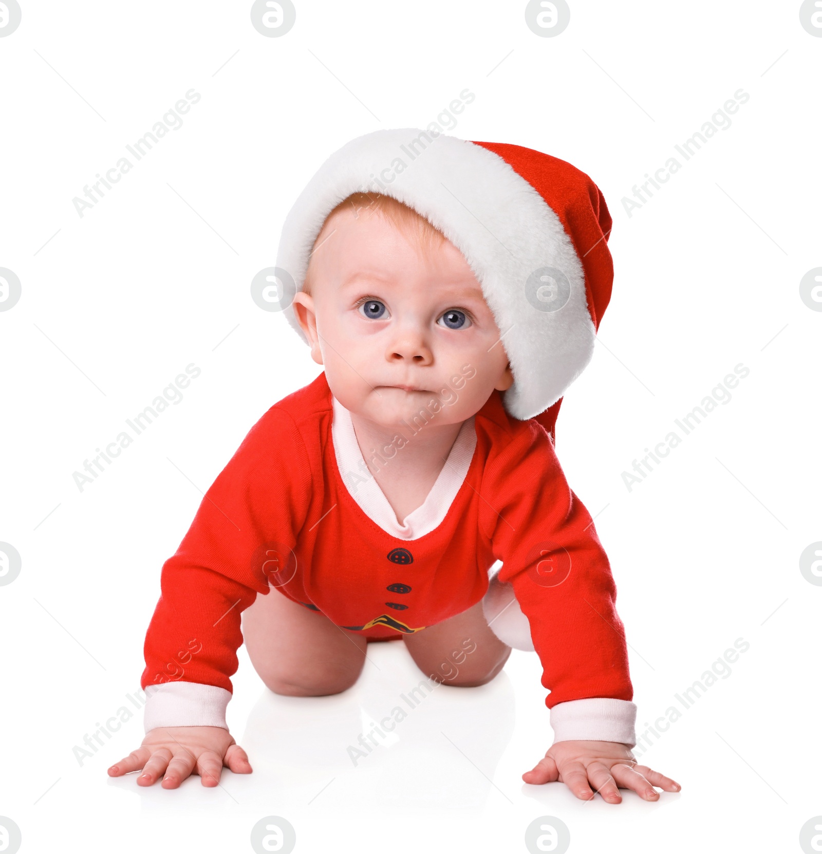 Photo of Cute little baby in Santa Claus suit on white background. Christmas celebration