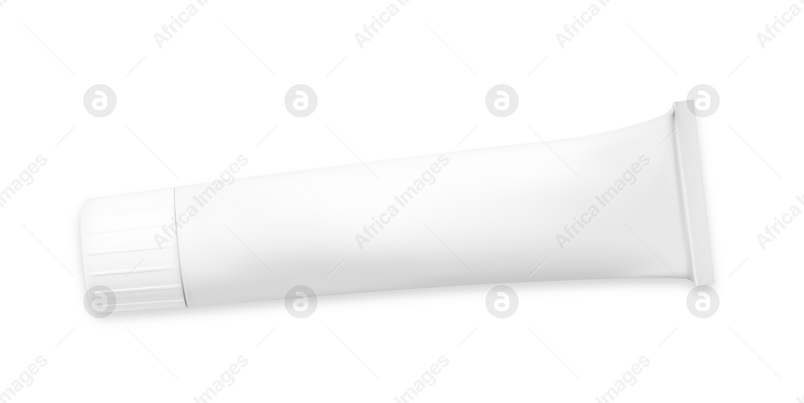 Photo of Tube of ointment isolated on white, top view. Space for text