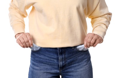 Photo of Poor woman showing empty pockets on white background, closeup