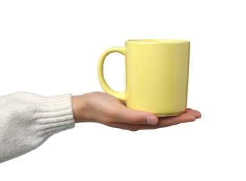 Photo of Woman holding yellow mug on white background, closeup