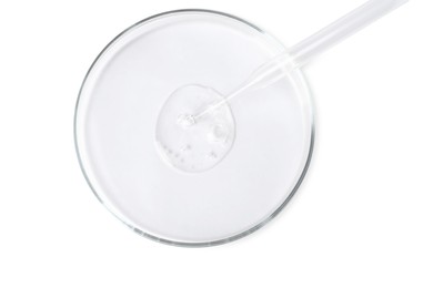 Photo of Glass pipette and petri dish with liquid on white background, top view