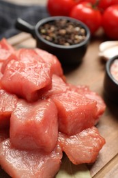 Photo of Cooking delicious goulash. Raw beef meat on table, closeup