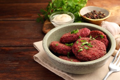 Photo of Tasty vegan cutlets served on wooden table, space for text
