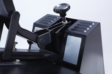 Photo of Heat press machine on light background, closeup view