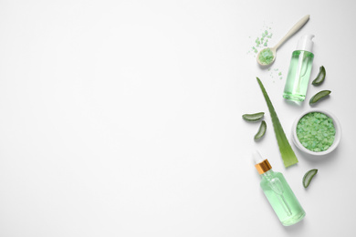 Photo of Flat lay composition with aloe vera and cosmetic products on white background
