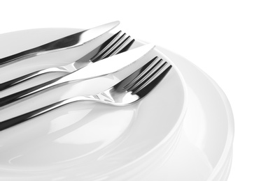 Photo of Stack of plates with forks and knife, closeup