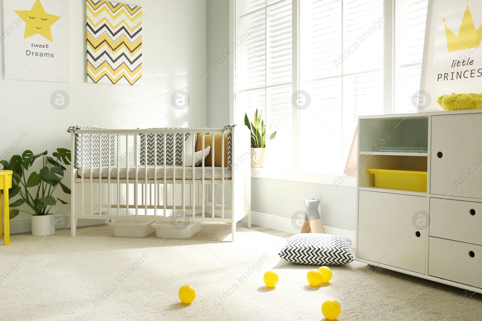 Cute baby room interior with crib and big window Photo of Cute baby room interior with crib and big window