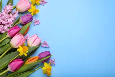Photo of Beautiful flowers on light blue background, flat lay. Space for text