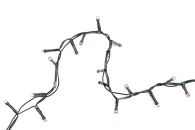 Photo of Beautiful Christmas lights on white background, top view