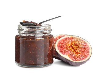Photo of Glass jar of tasty sweet fig jam and spoon isolated on white