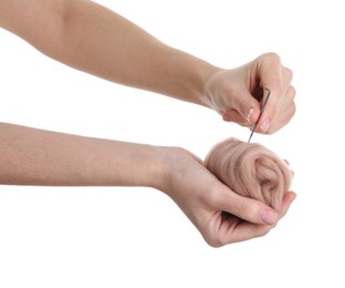Photo of Woman needle felting from wool on white background, closeup