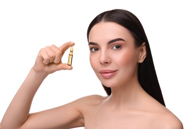 Photo of Beautiful young woman holding skincare ampoule on white background