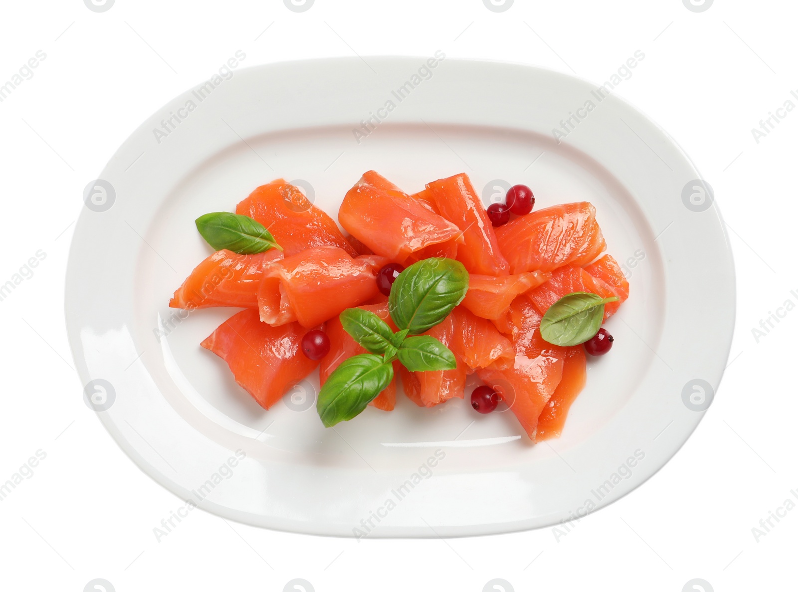 Photo of Salmon carpaccio with cranberries and basil isolated on white, top view