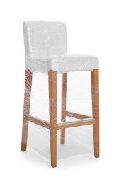Photo of Chair wrapped in stretch film on white background