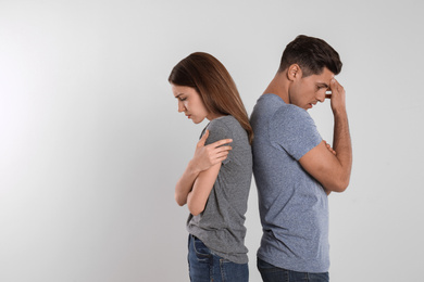 Photo of Couple with relationship problems on light background