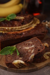 Photo of Delicious banana bread on brown table, closeup