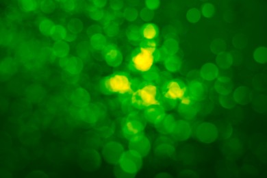 Image of St. Patrick day. Green background with blurred lights, bokeh effect