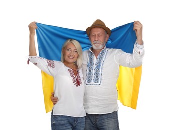 Photo of Happy mature couple with national flag of Ukraine on white background