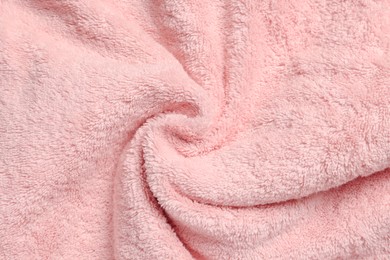 Photo of Soft crumpled pink towel as background, top view