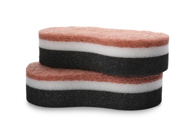 Layered cleaning sponges with abrasive scourers on white background