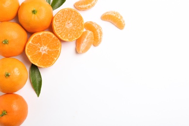 Photo of Composition with tangerines and leaves on white background, top view. Space for text