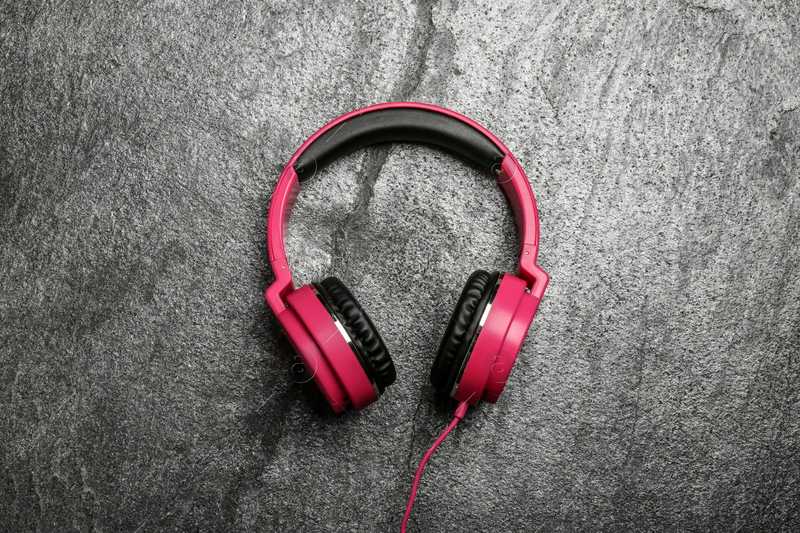 Photo of Stylish headphones on grey background, top view