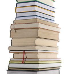 Stack of many different books isolated on white