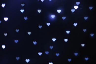 Photo of Beautiful heart shaped lights on dark background