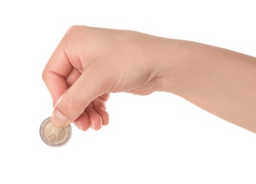 Woman holding coin in hand on white background, closeup