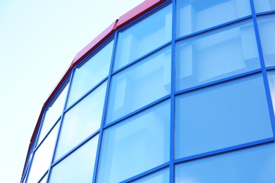 Modern office building with tinted windows against blue sky