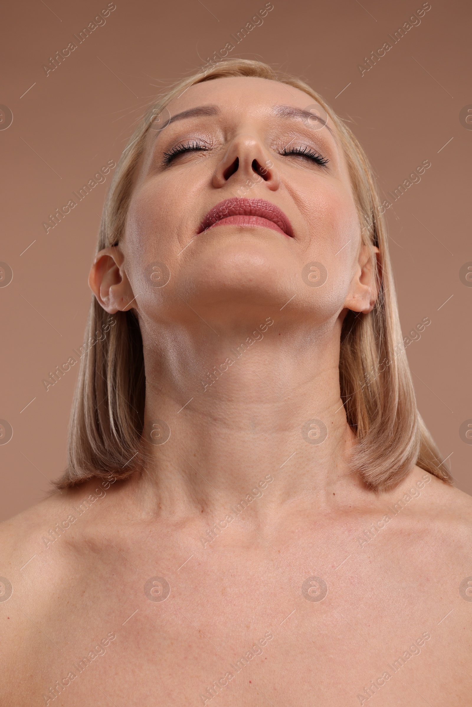 Photo of Beautiful woman with healthy skin on beige background