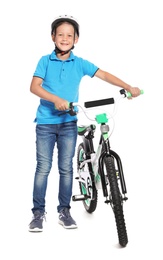 Portrait of cute little boy with bicycle on white background