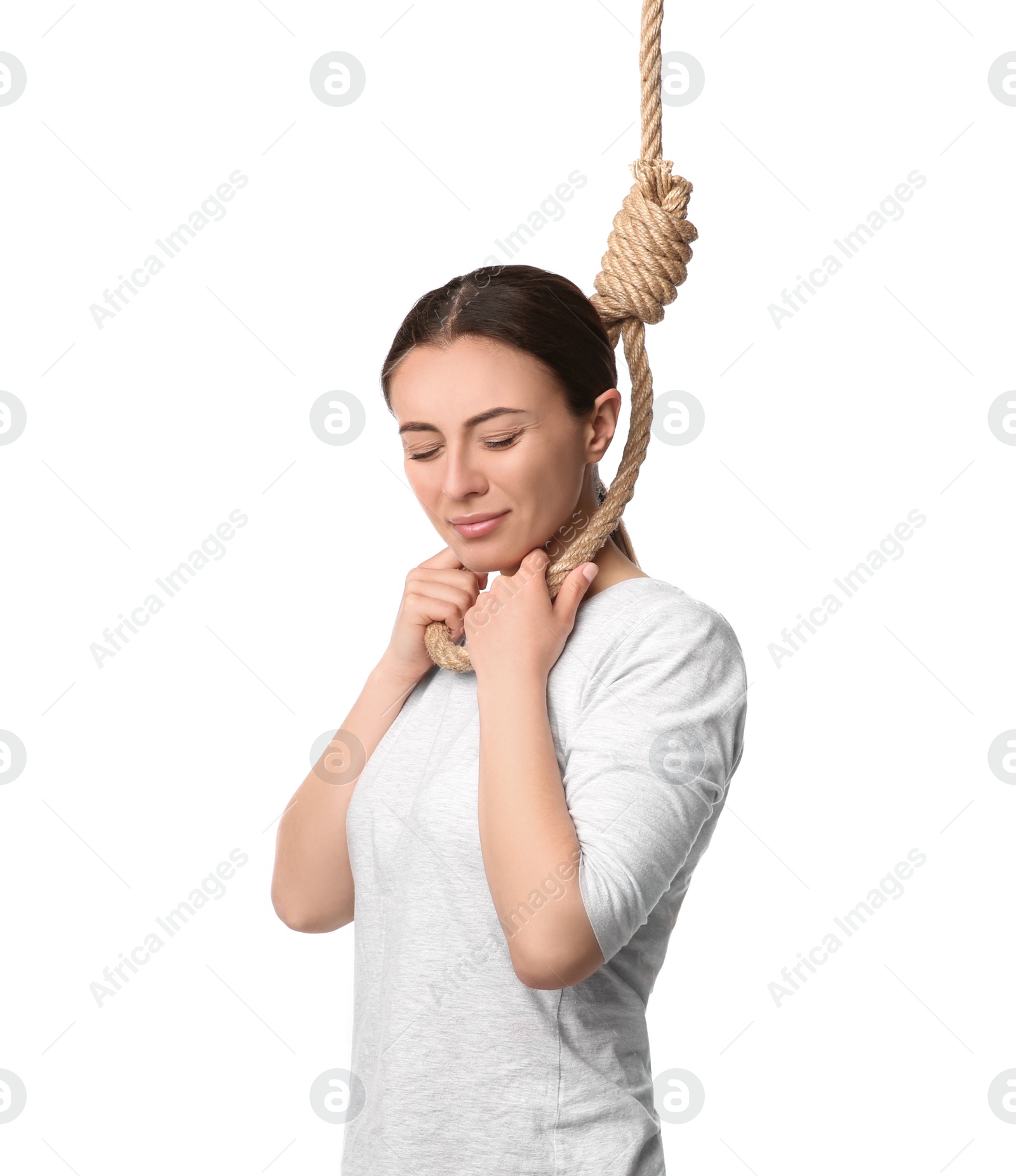 Photo of Depressed woman with rope noose on neck against white background