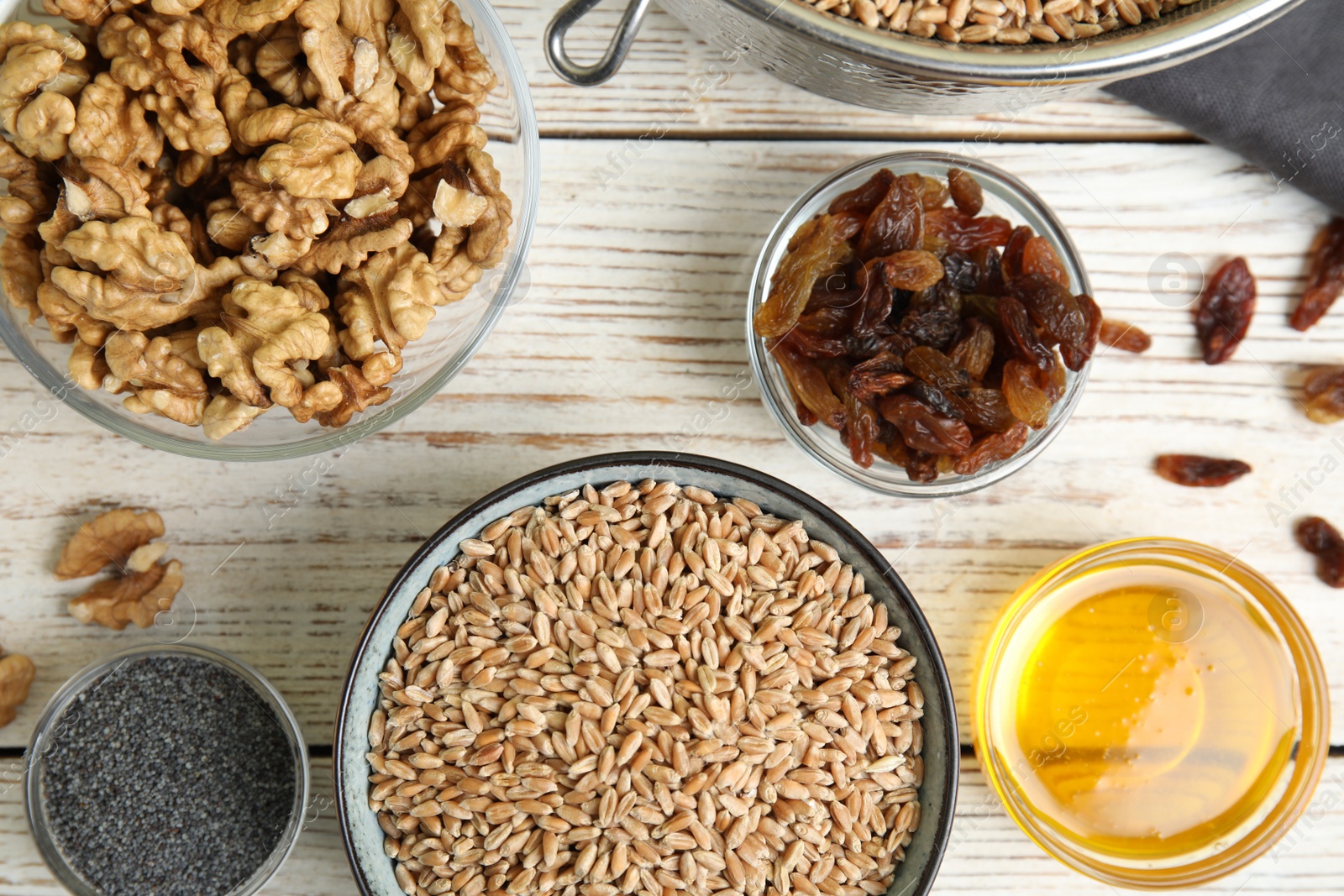 Photo of Ingredients for traditional kutia on white wooden table, flat lay