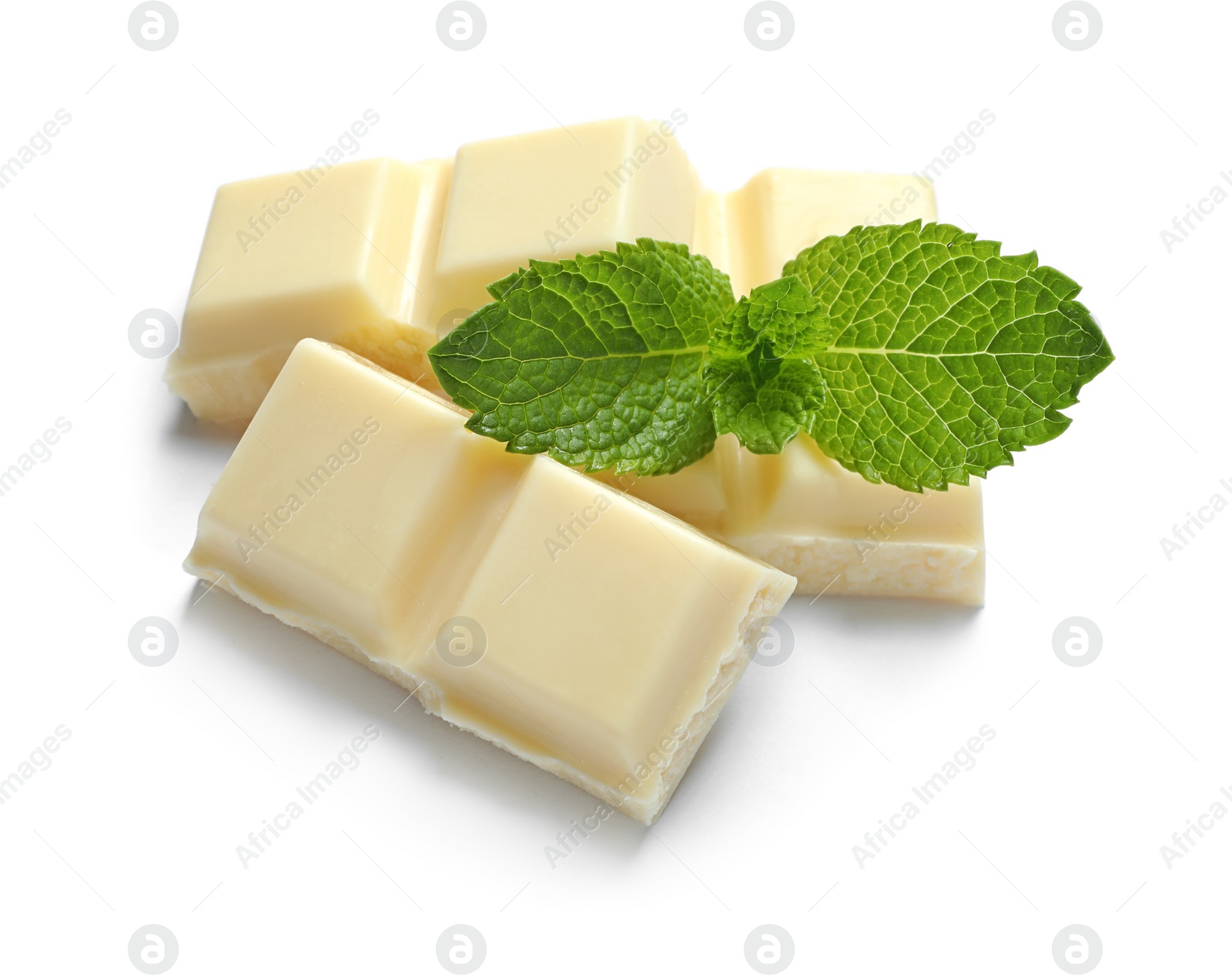 Photo of Pieces of white chocolate with mint on white background