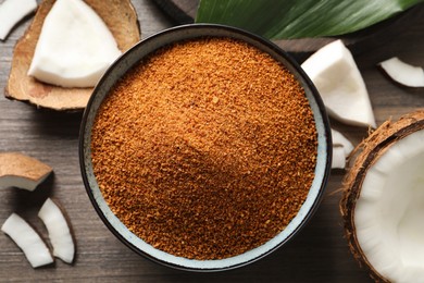 Flat lay composition with natural coconut sugar on wooden table