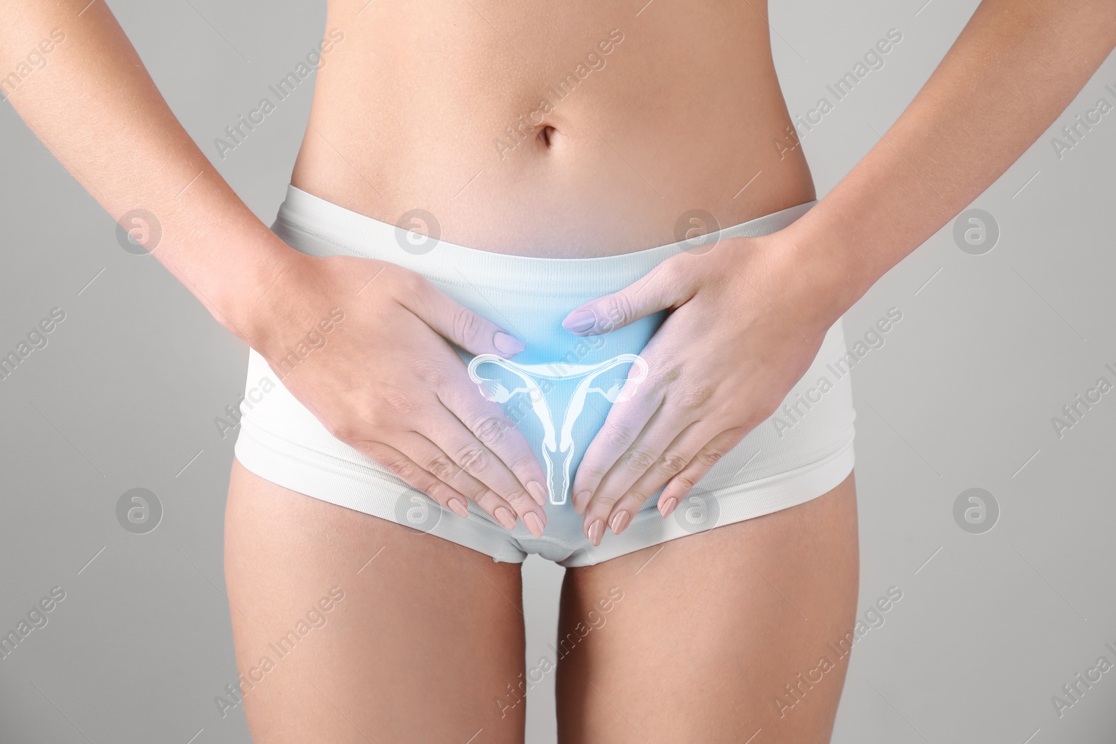 Image of Woman in underwear and illustration of reproductive system on light grey background, closeup