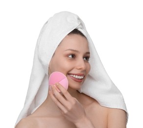 Photo of Washing face. Young woman with cleansing brush on white background