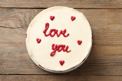 Bento cake with text Love You on wooden table, top view. St. Valentine's day surprise