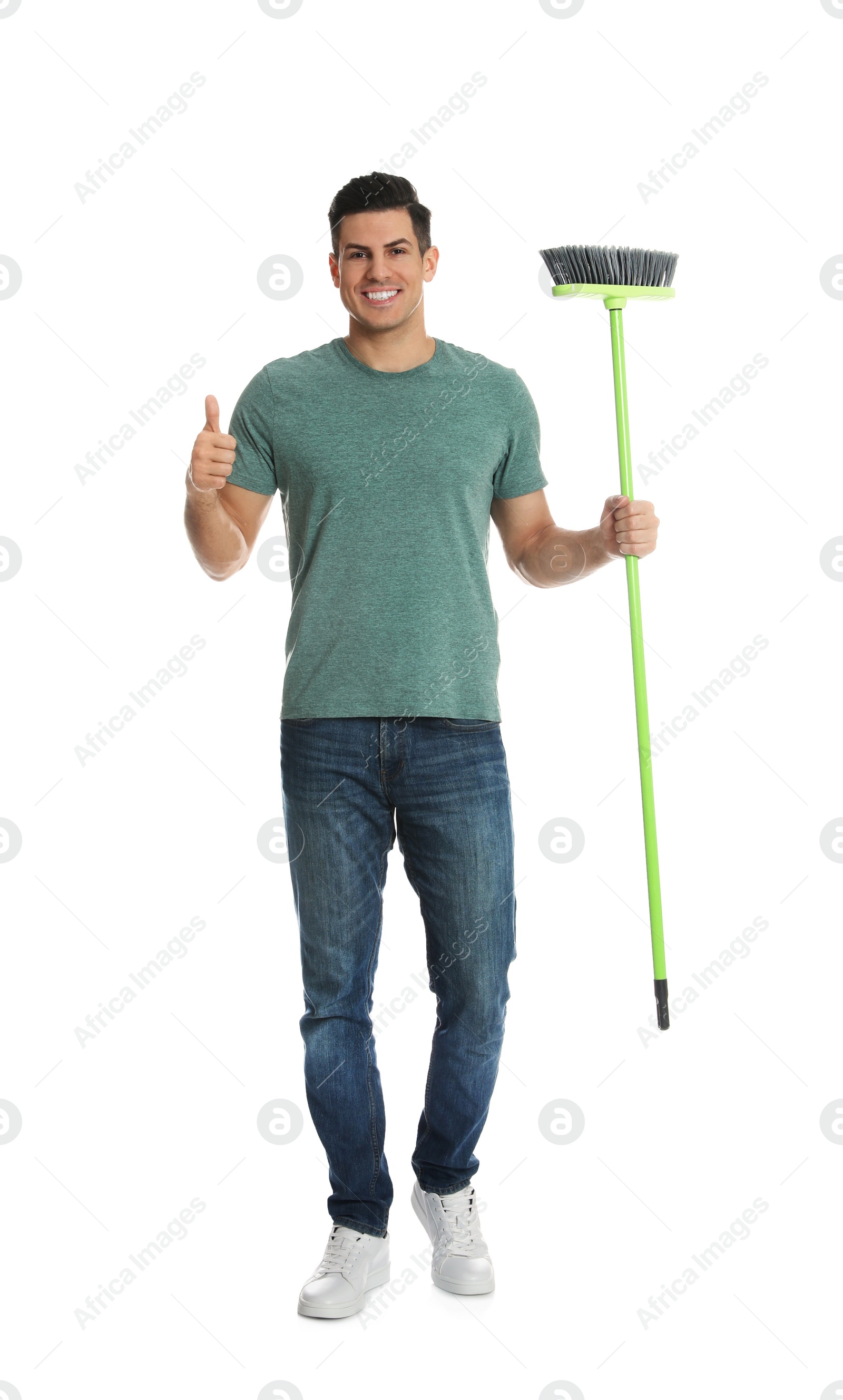 Photo of Man with green broom on white background