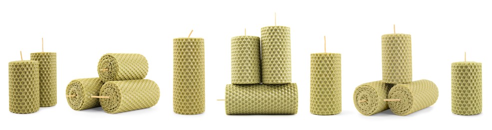 Set of beeswax candles on white background