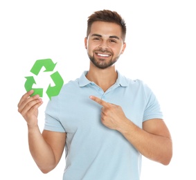 Photo of Young man with recycling symbol on white background