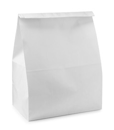 Closed paper grocery bag isolated on white