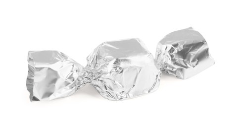 Tasty candy in silver wrapper isolated on white