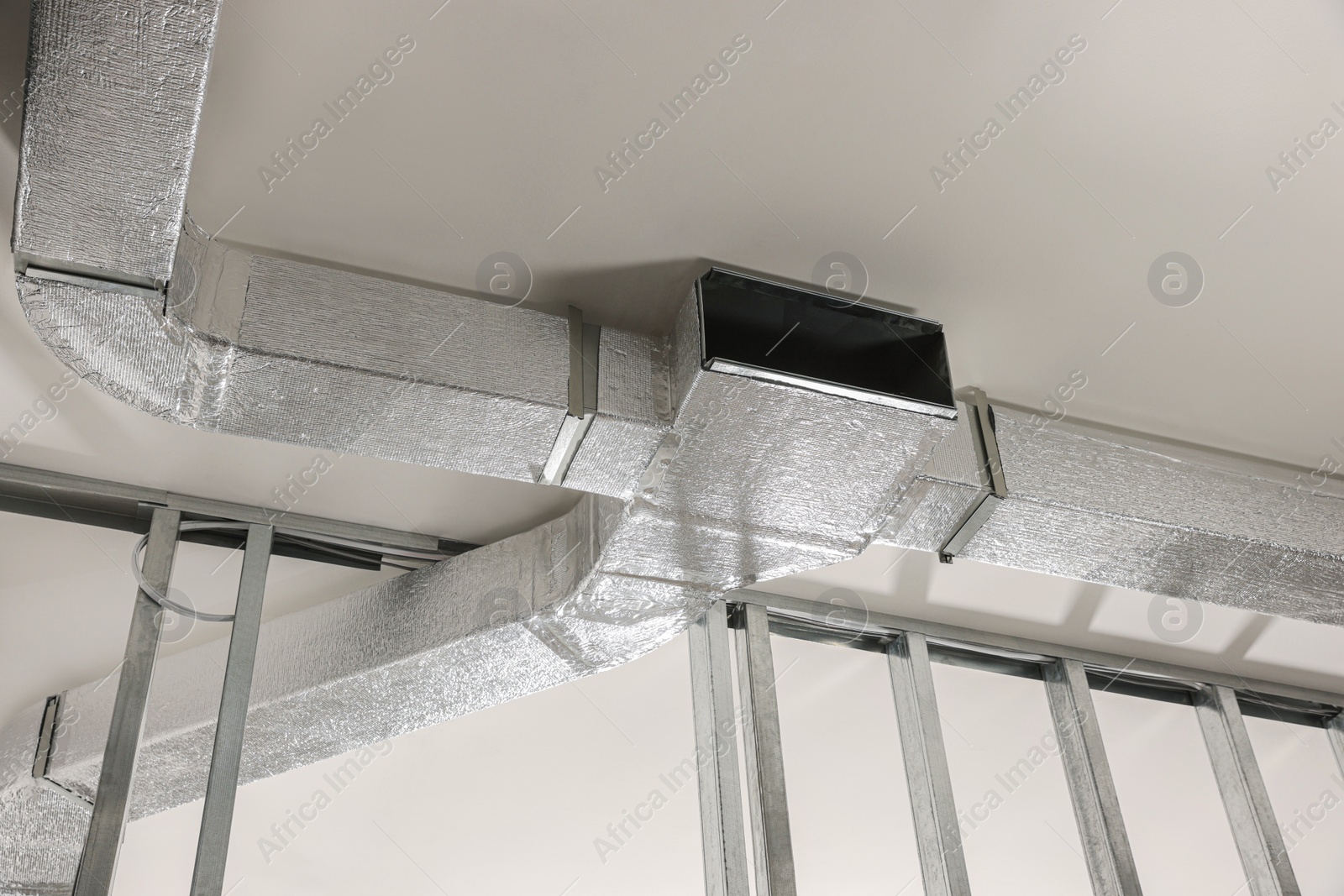 Photo of Ceiling with ventilation system indoors, bottom view