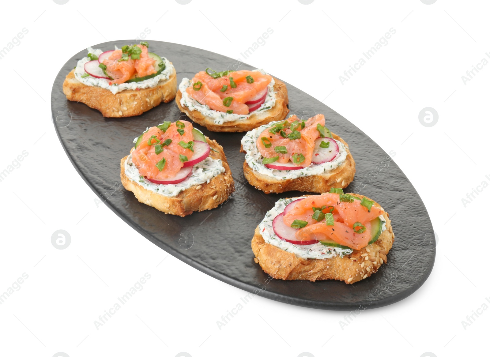 Photo of Tasty canapes with salmon, cucumber, radish and cream cheese isolated on white