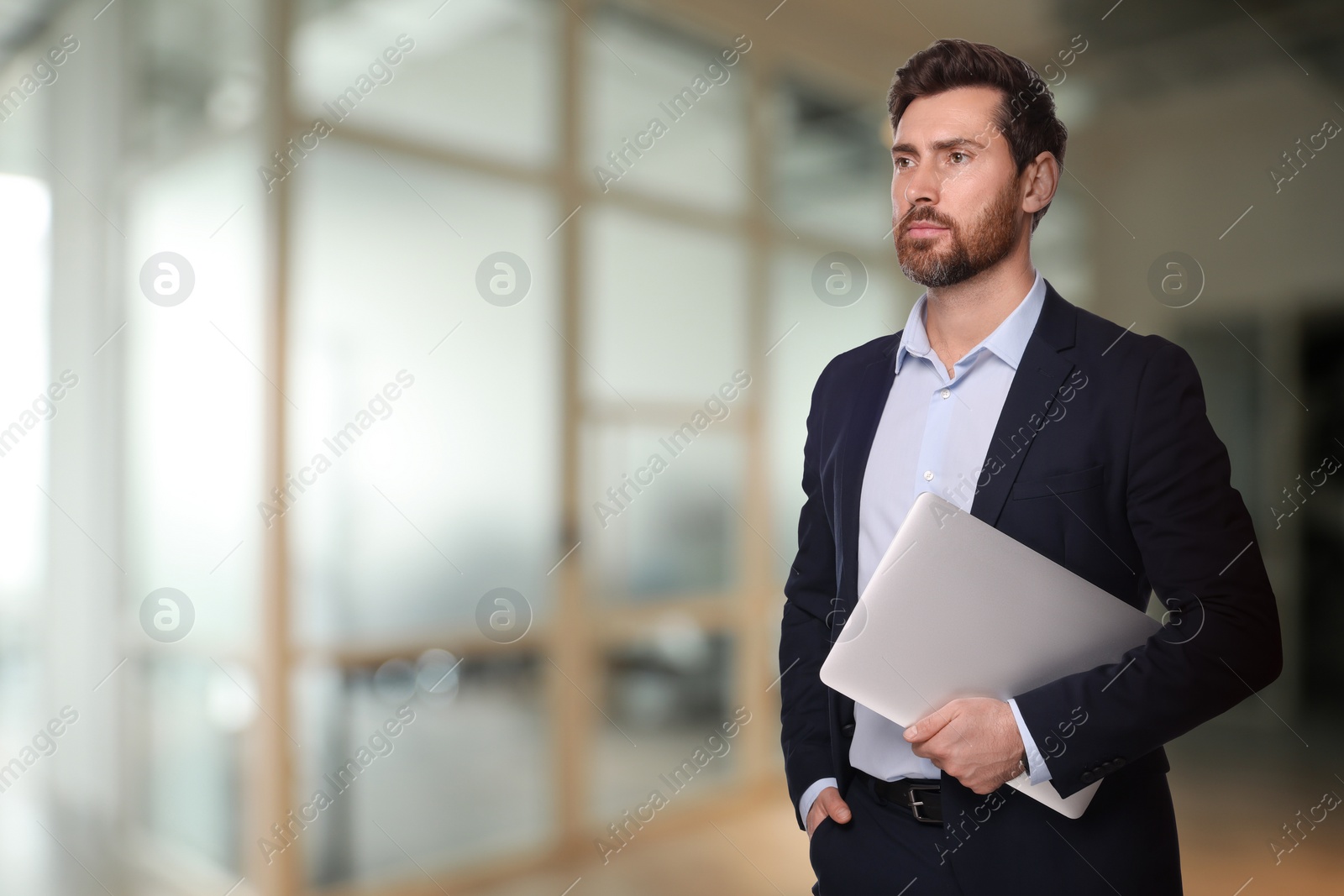 Image of Successful lawyer with laptop on blurred background, space for text