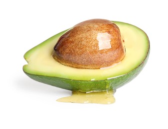 Photo of Half of avocado with essential oil on white background